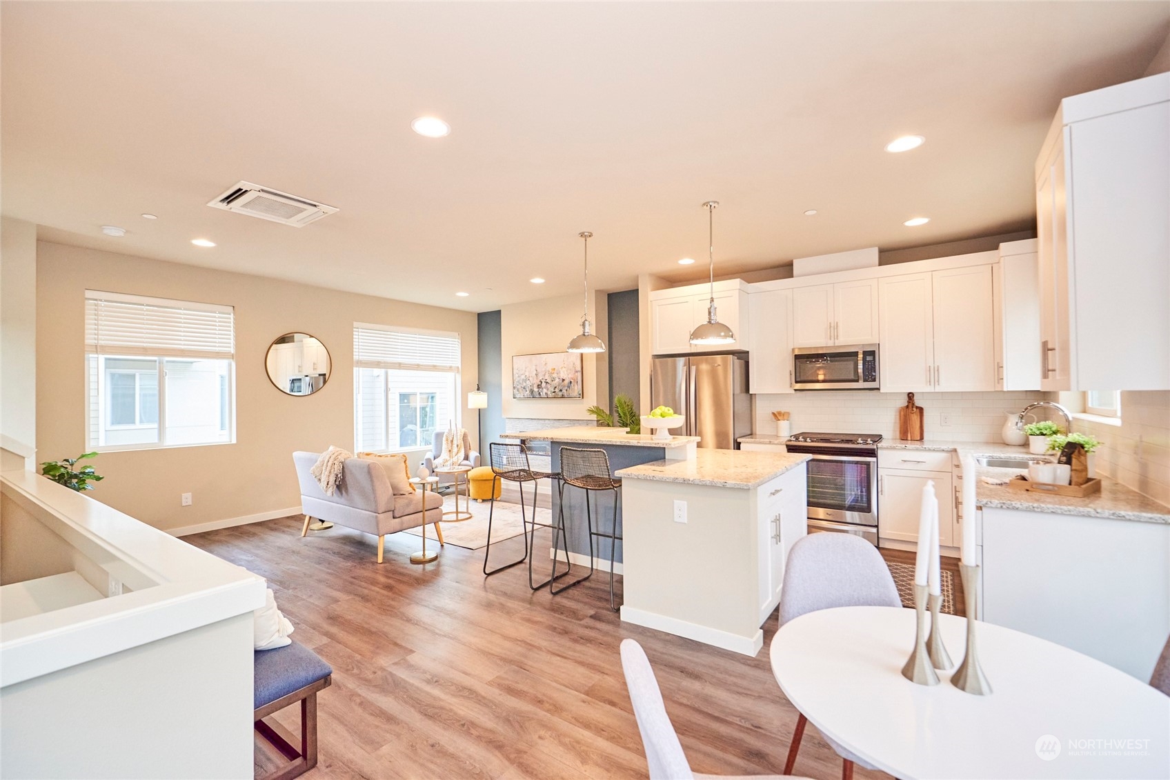 A view of the main living space from the top of the entry stairs. This home is move in ready!