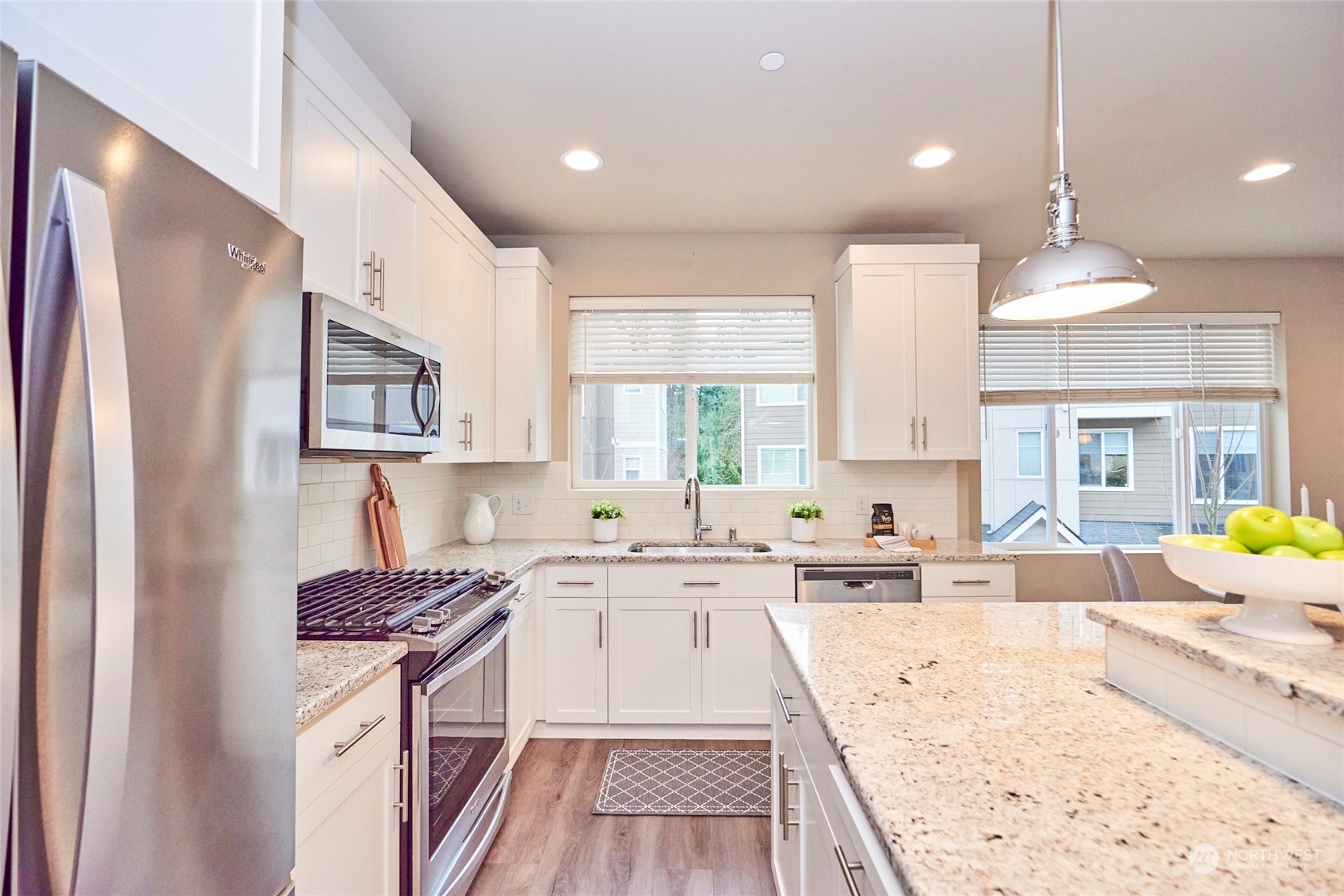 Tons of counter space and storage in this modern kitchen.