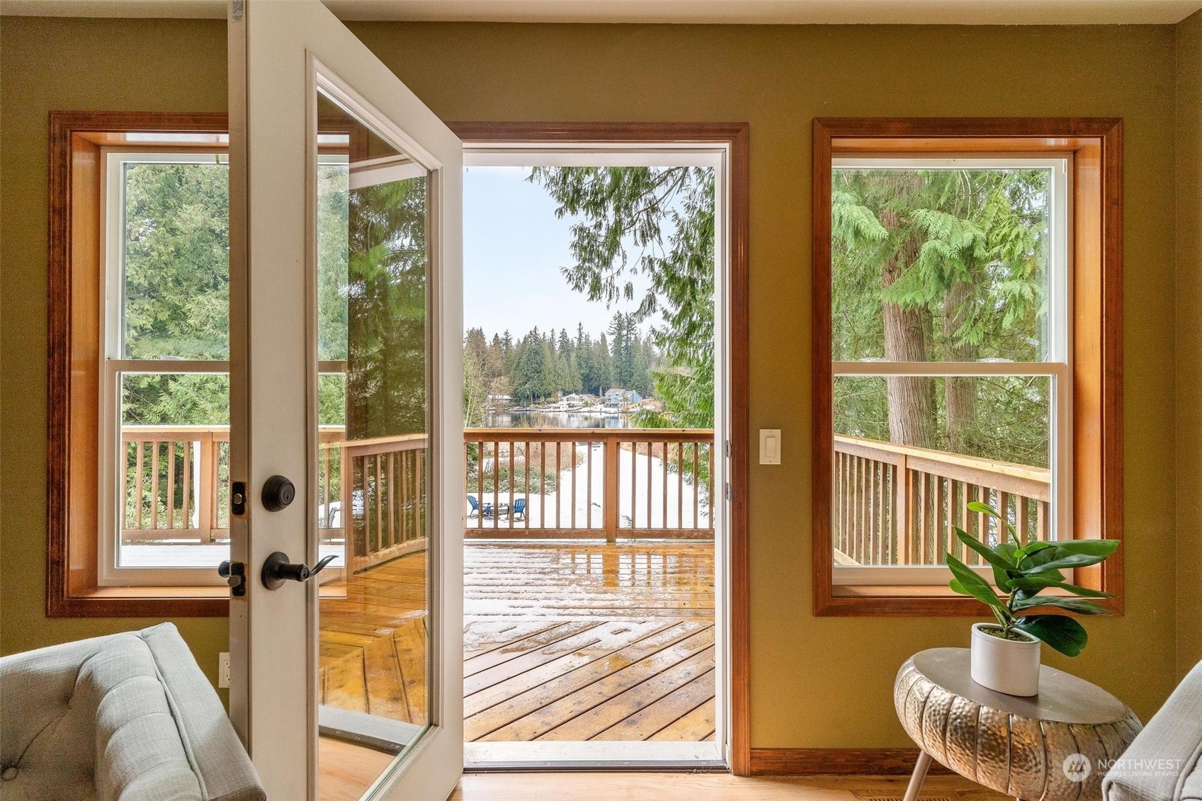 A private office with floor-to-ceiling windows overlooks the tranquil lake, making every workday feel inspiring.