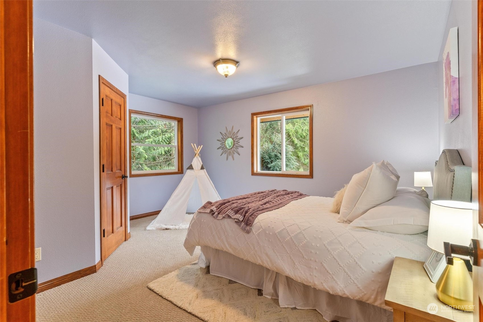 3rd bedroom w/a plush carpeting, a neutral color palette, and ample space.