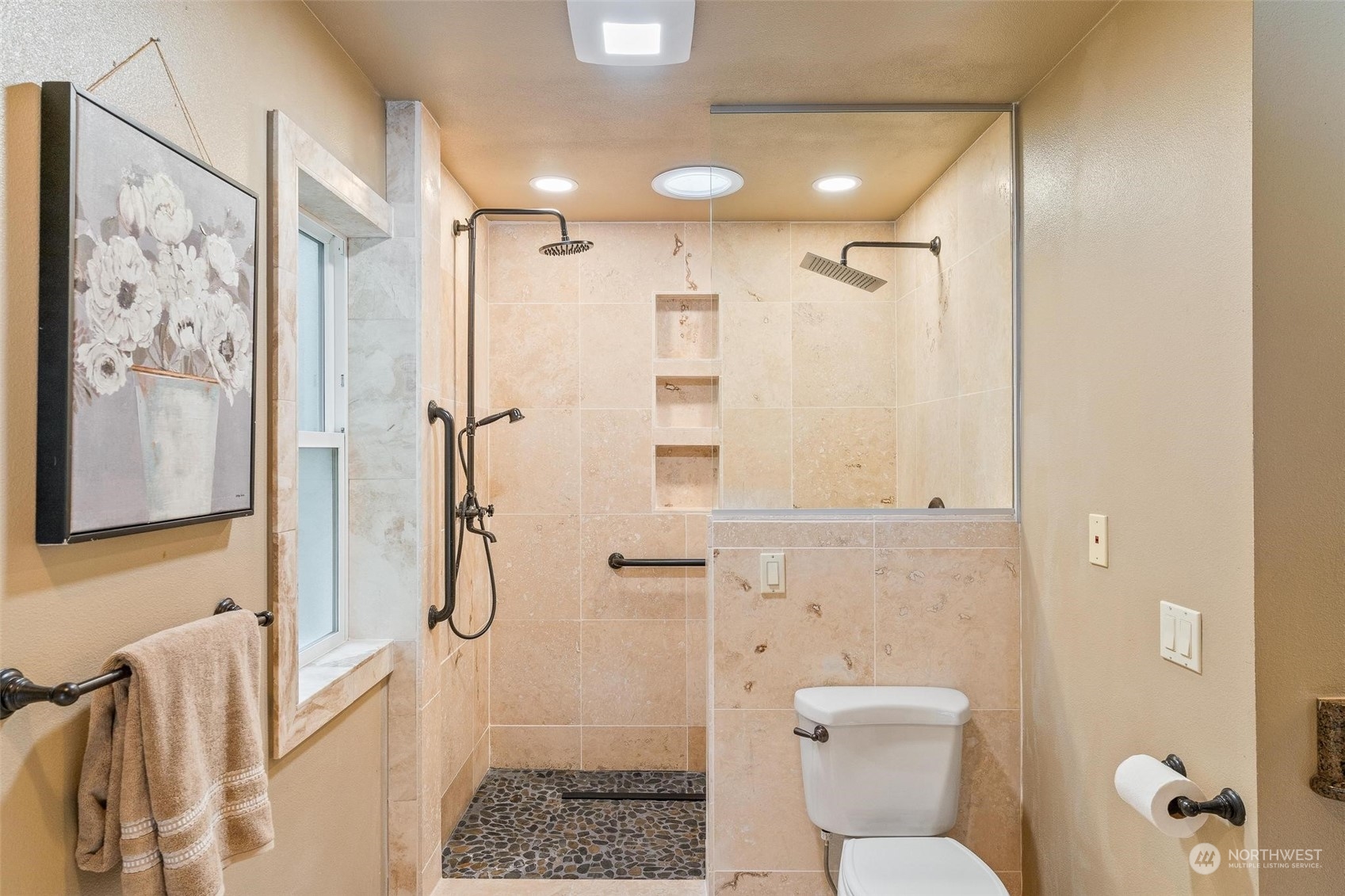 Shared full bathroom with modern fixtures, dual vanities, and a soaking tub for ultimate convenience.