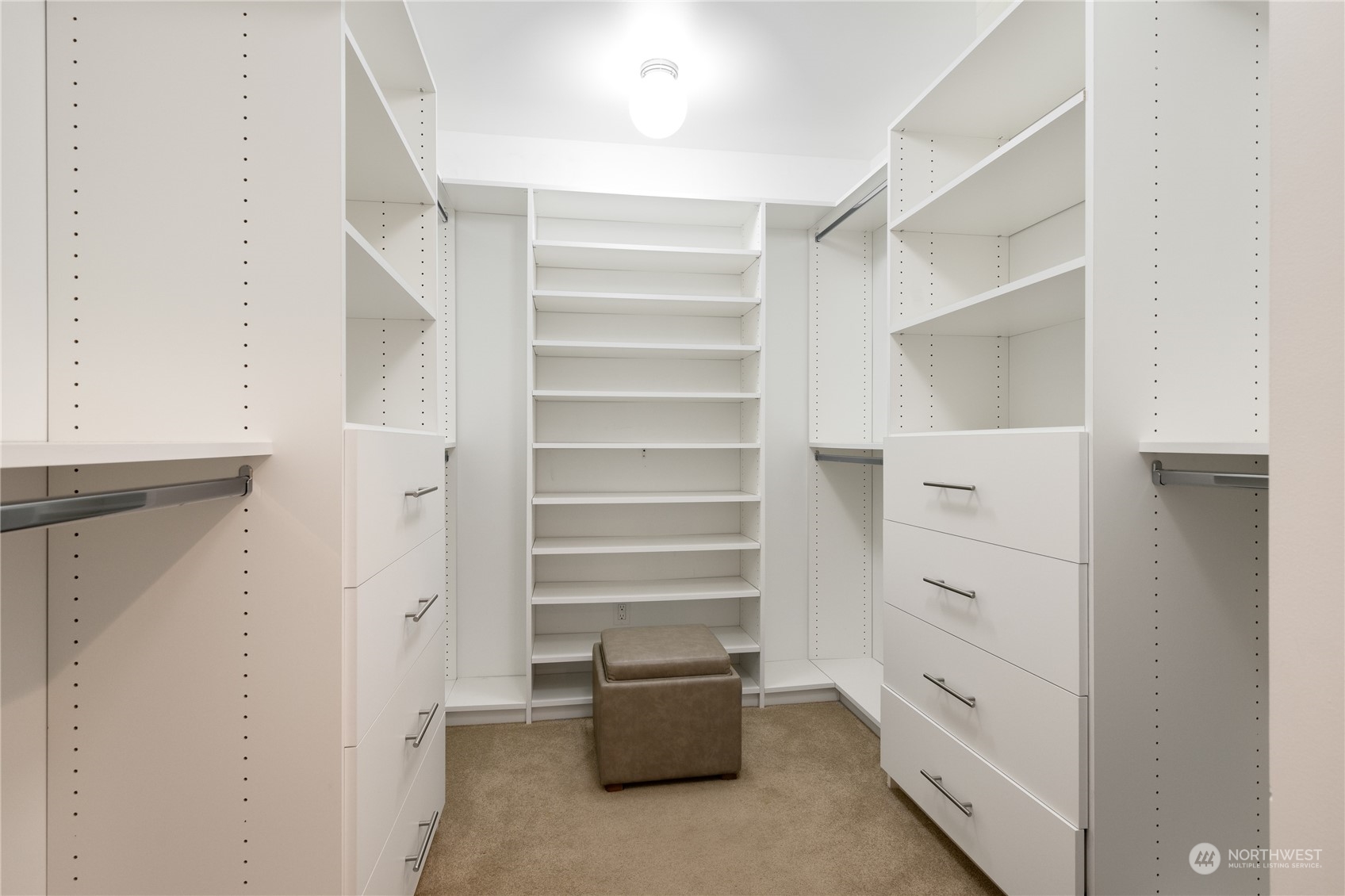 primary suite closet, outfitted by Closets by Design