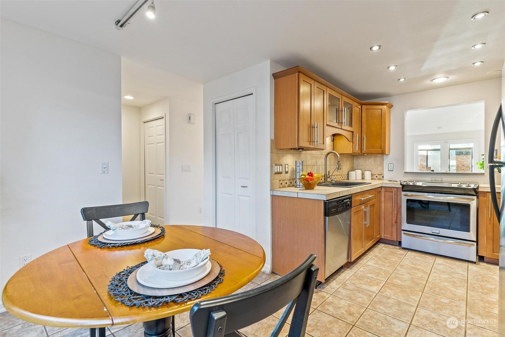 Kitchen has lots of space for your breakfast table and more cabinets!