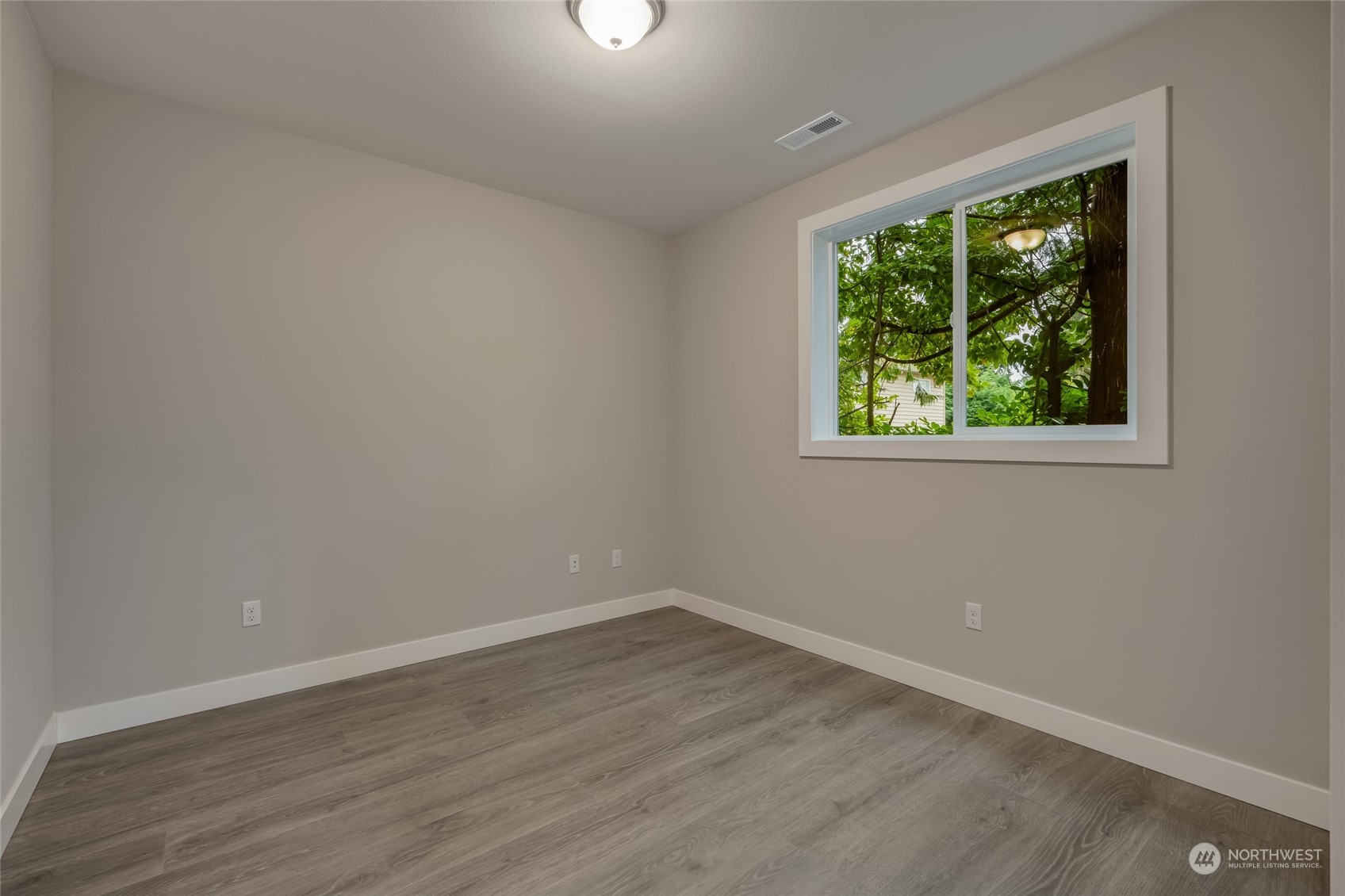 One of the bedrooms is conveniently located on the main floor, making it the perfect space for a mother-in-law suite, guest room, home office, or for multi-generational living.  [Finishes are of 713, but 715 will be similar in finishes.]