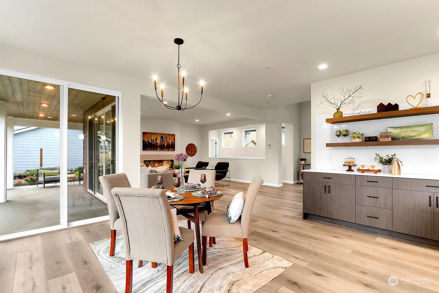 Floating shelves above the built in buffet/coffee bar provide a gorgeous airy look to display decor and provide storage.