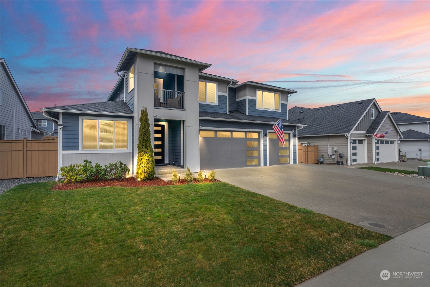 Extended paved driveway with RV parking behind the gate.