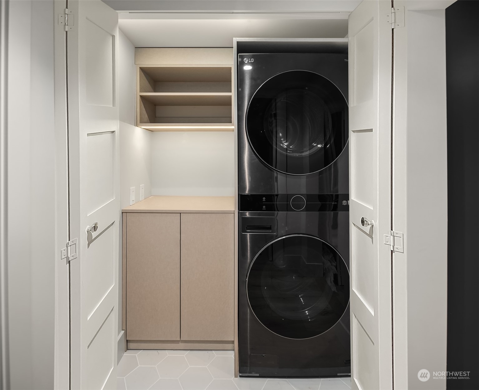 Lower level laundry with storage.