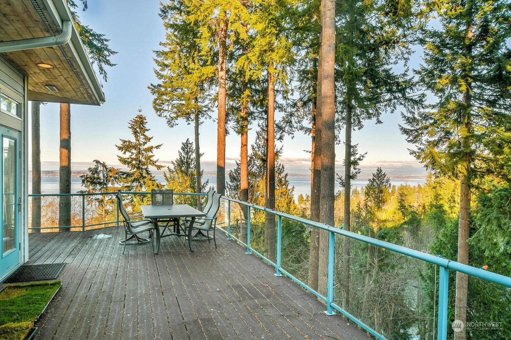 Relax on this expansive wraparound deck, offering stunning water views and fresh air from the surrounding trees—recently professionally cleaned and ready to enjoy!