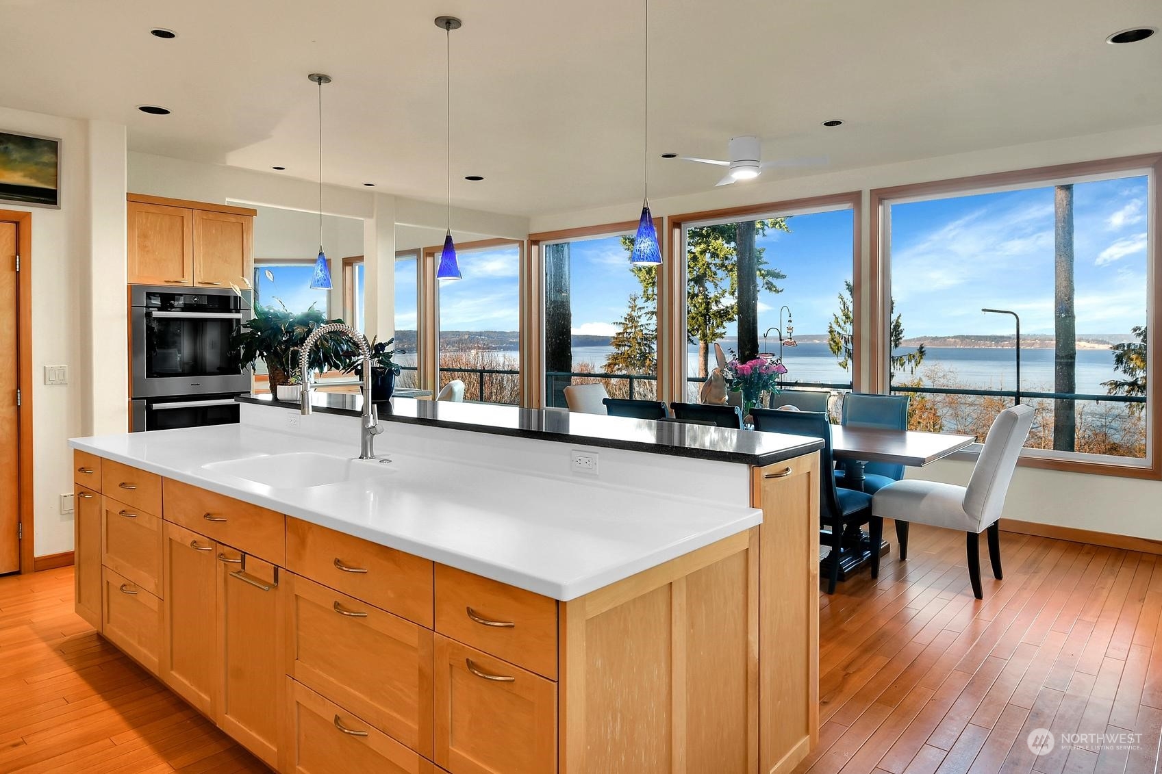 Experience breathtaking water views from this elegant kitchen and dining space, designed for both luxury and comfort.