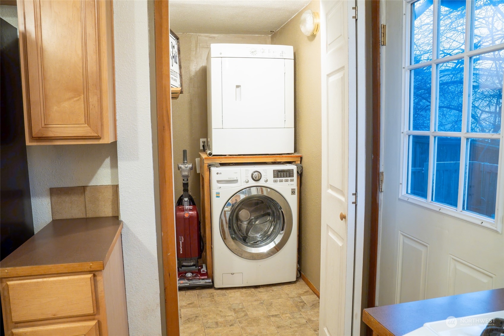 Washer/Dryer tucked away in Utility closet. Both stay with home.