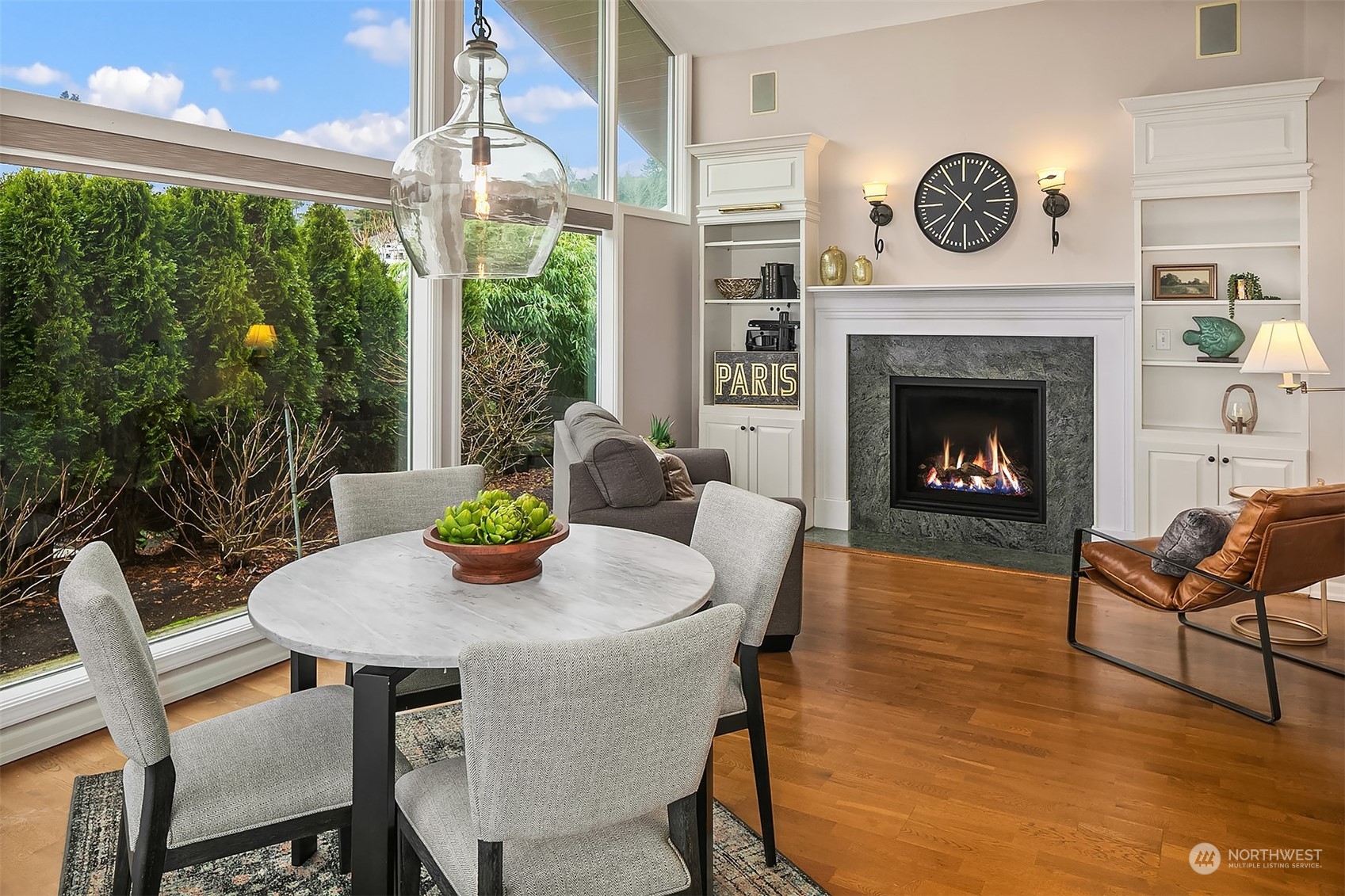 Cozy family room off the kitchen is a precursor to todays great room. Warm gas fireplace, built in bookcases and hardwood floors make this an inviting spot year round!