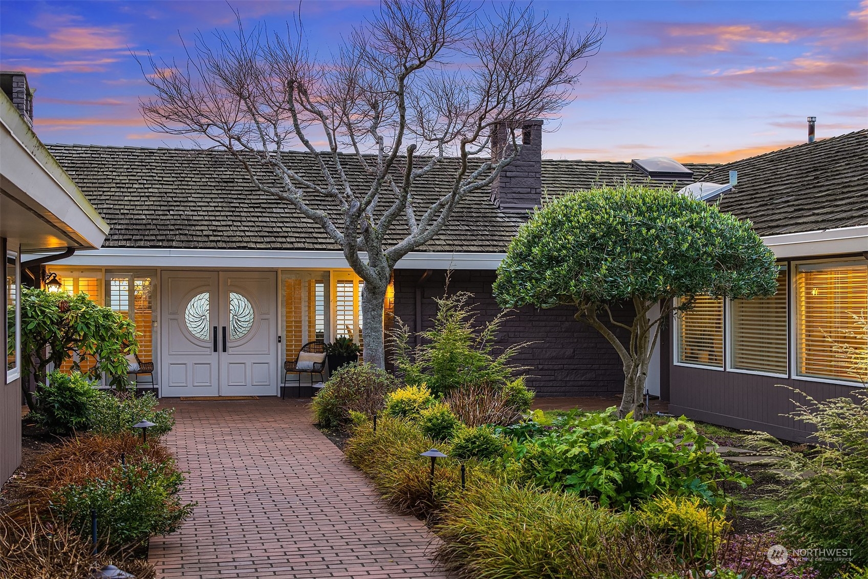 Such a welcoming front door with a long front walk. A true sense of arrival. The path is well lit and thoughtfully planted.