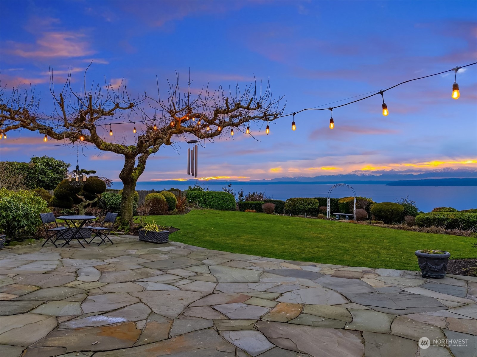 Flagstone patios run the length of the back of the house just adding to the fabulous outdoor living experience.