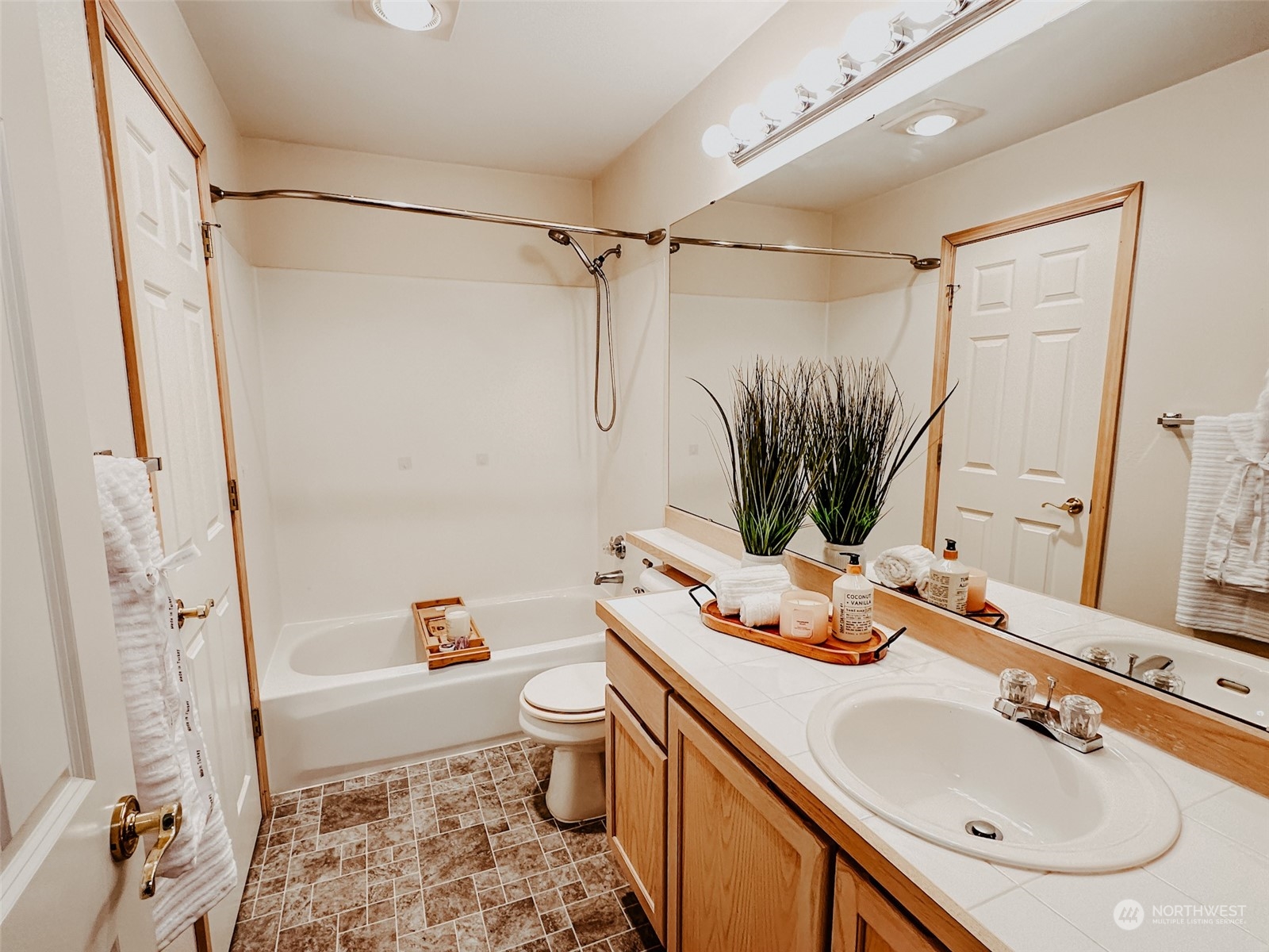 En-suite bathroom boasts a combination of function and luxury, highlighted by a full-size bathtub for a tranquil retreat