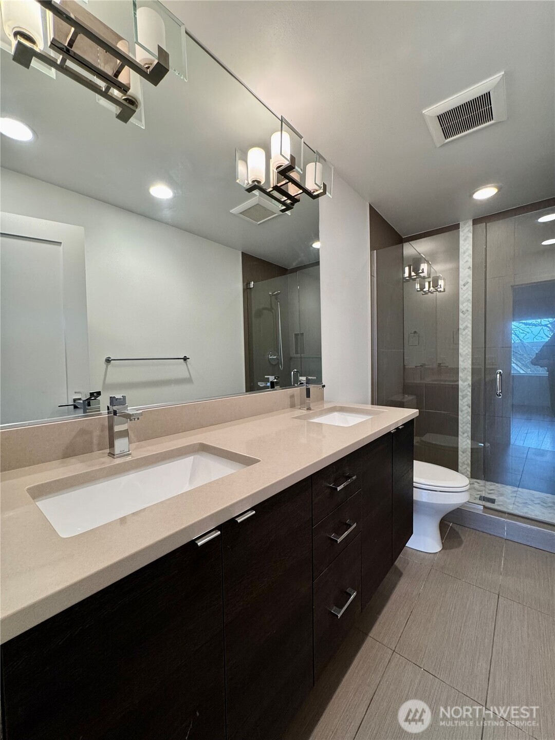 Double vanity sink, plenty of storage and walk-n shower for primary bath.