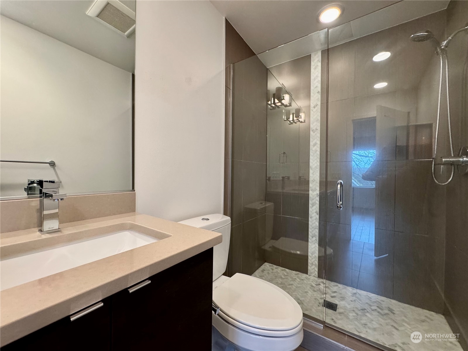 Quartz countertops, walk-in shower.