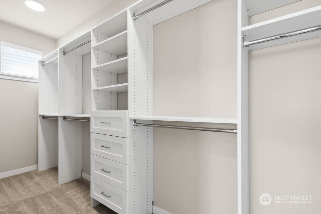 Love this closet system in the primary bedroom walk in closet!