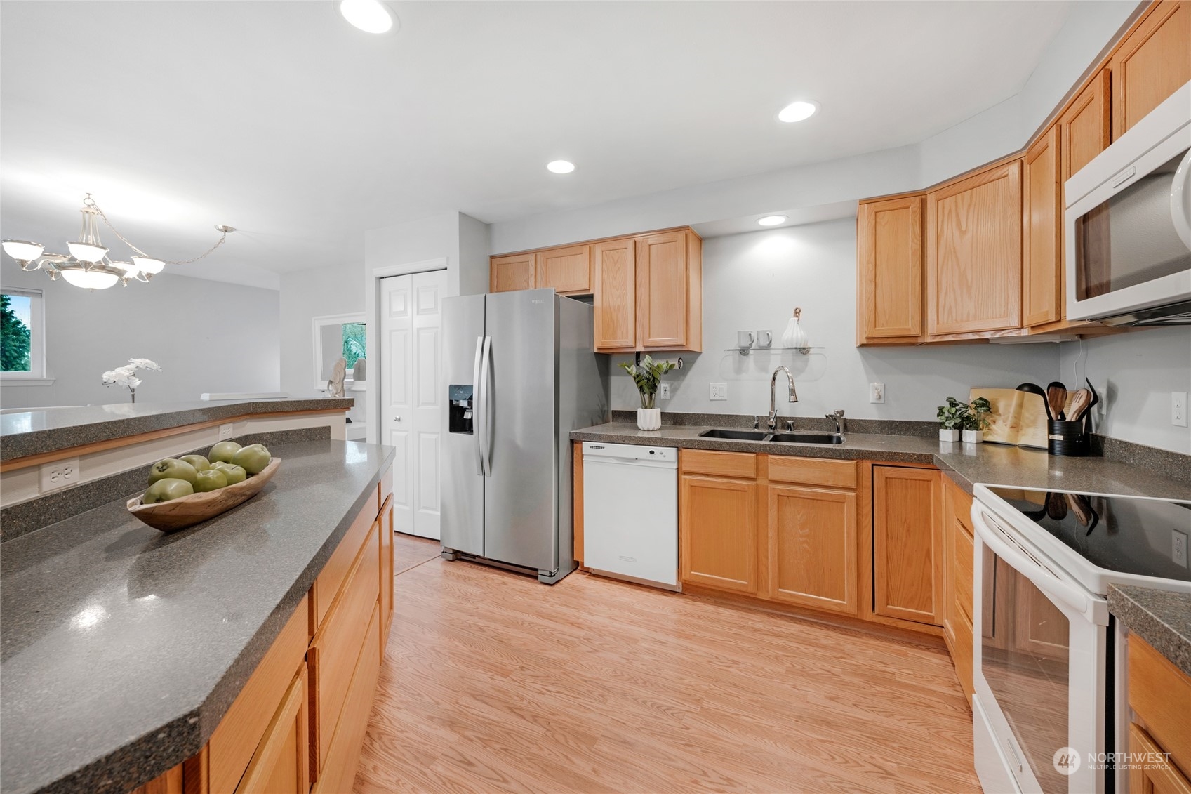 A great design to create your meals and enough room to move around. An incredible amount of cabinets and drawers. The refrigerator has an icemaker and filtered water dispenser in the door.