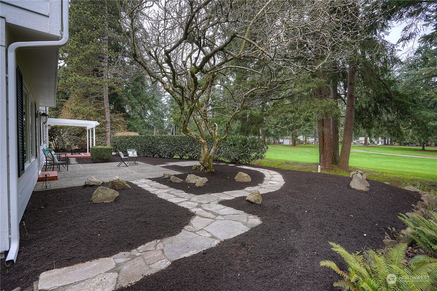 Walk the pathways to the many patios in the back yard