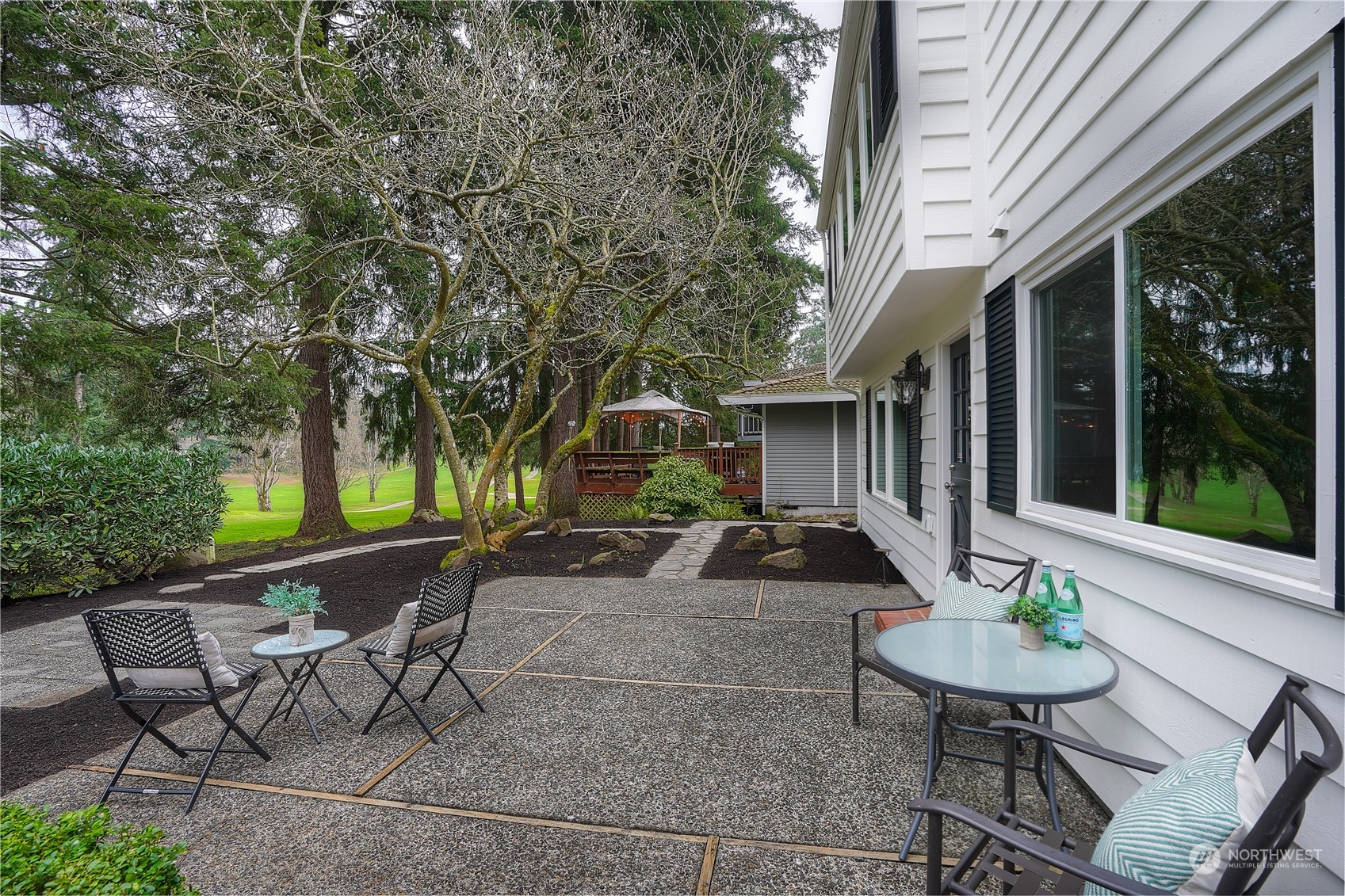 This patio has a hedge in front of it for a little privacy