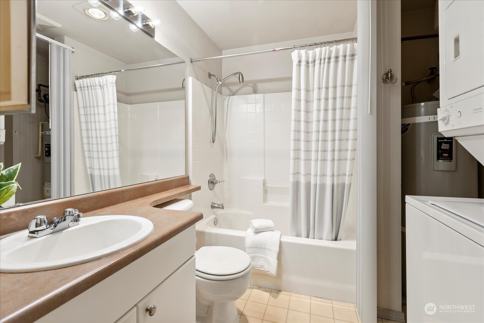 Full bath with convenient in-unit washer and dryer