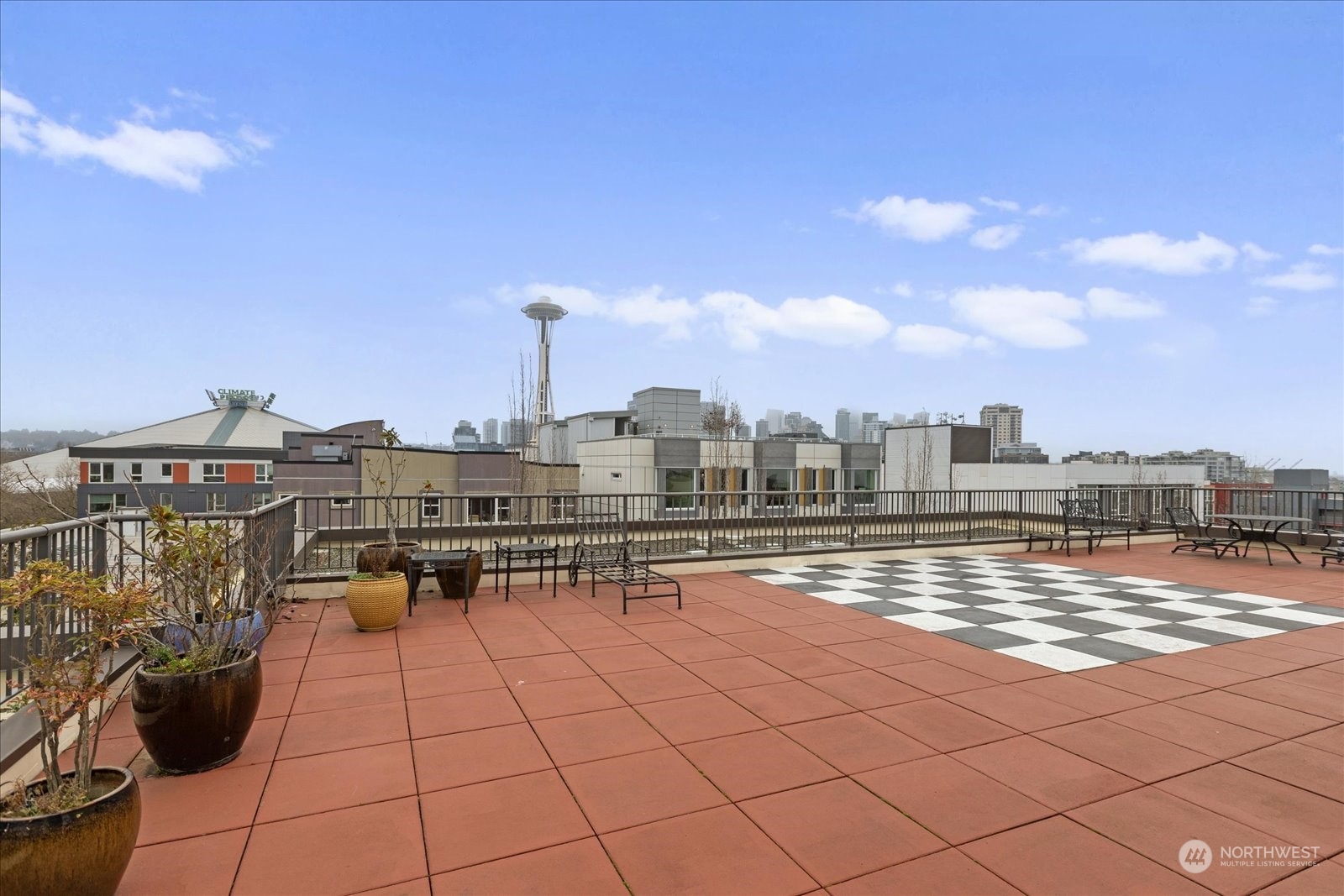 Looking East off the rooftop deck to see the Space Needle and Climate Pledge Arena