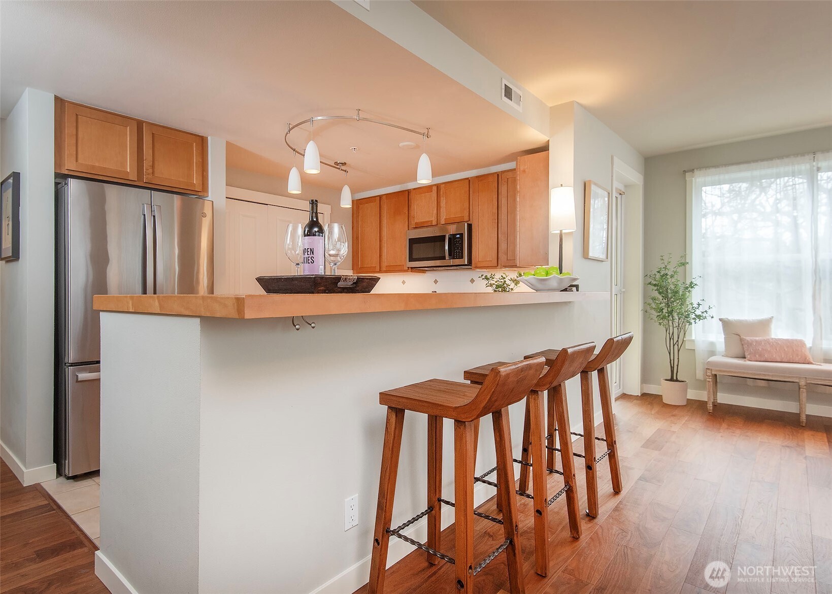 Spacious living area with bar top seating