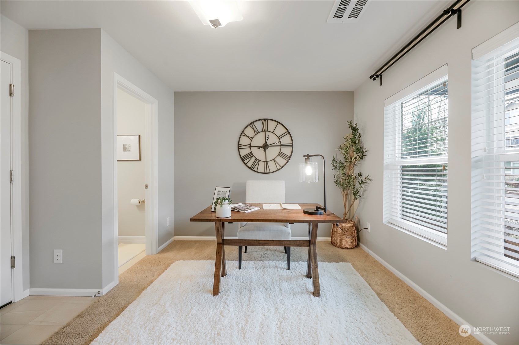 First floor den with natural light and powder room