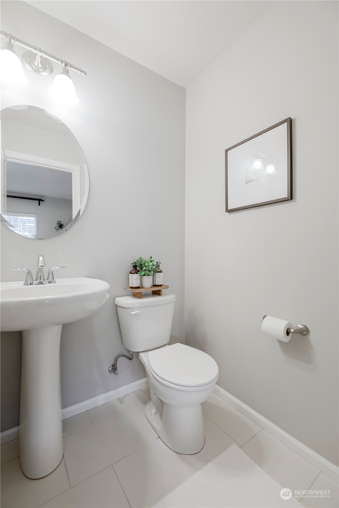 Powder room in den has builder upgraded tile flooring