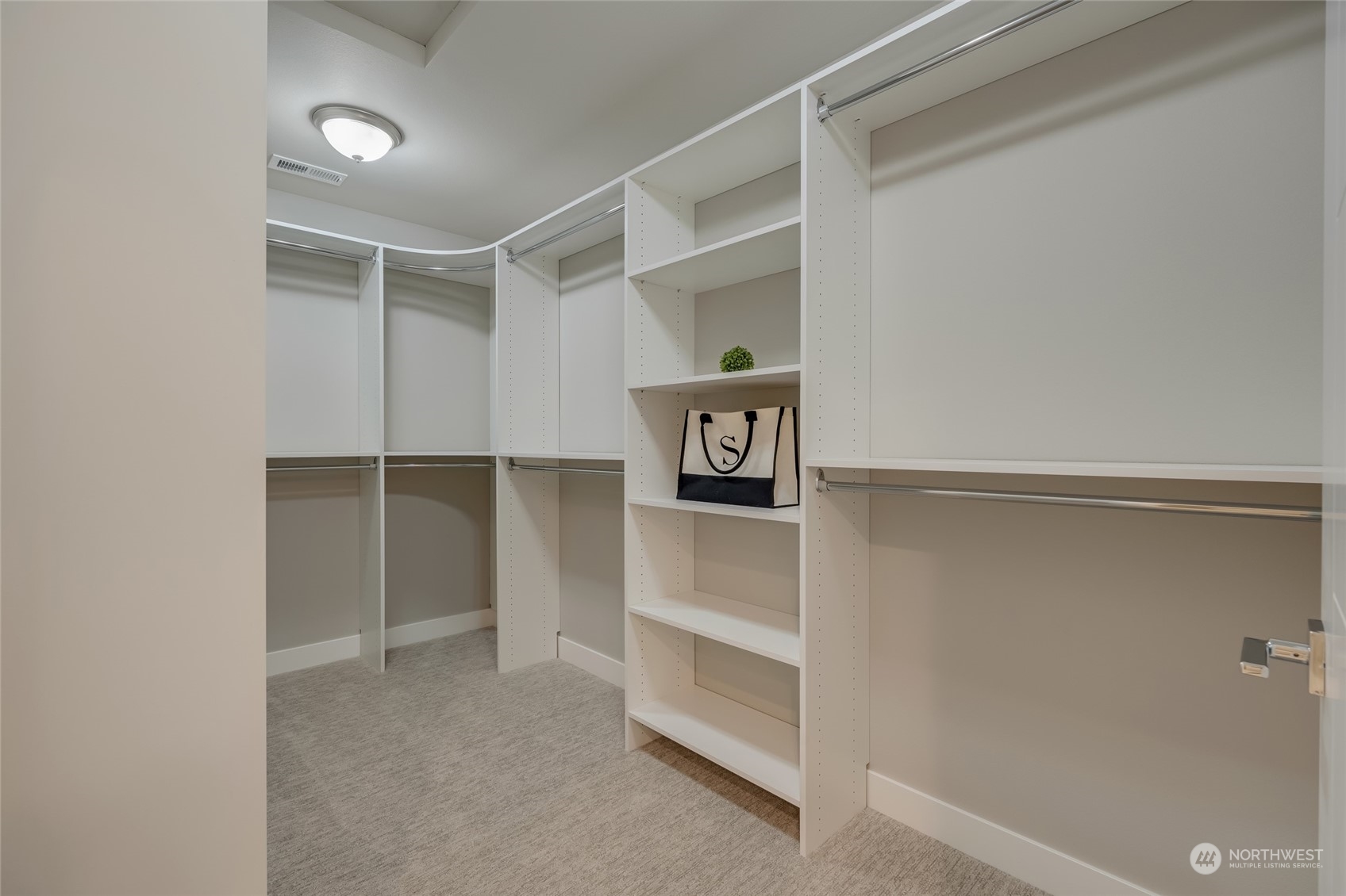 The centerpiece of the suite is the massive walk-in closet, offering ample space to organize and display your wardrobe and accessories.   [Finishes are of 713, but 715 will be similar in finishes.]