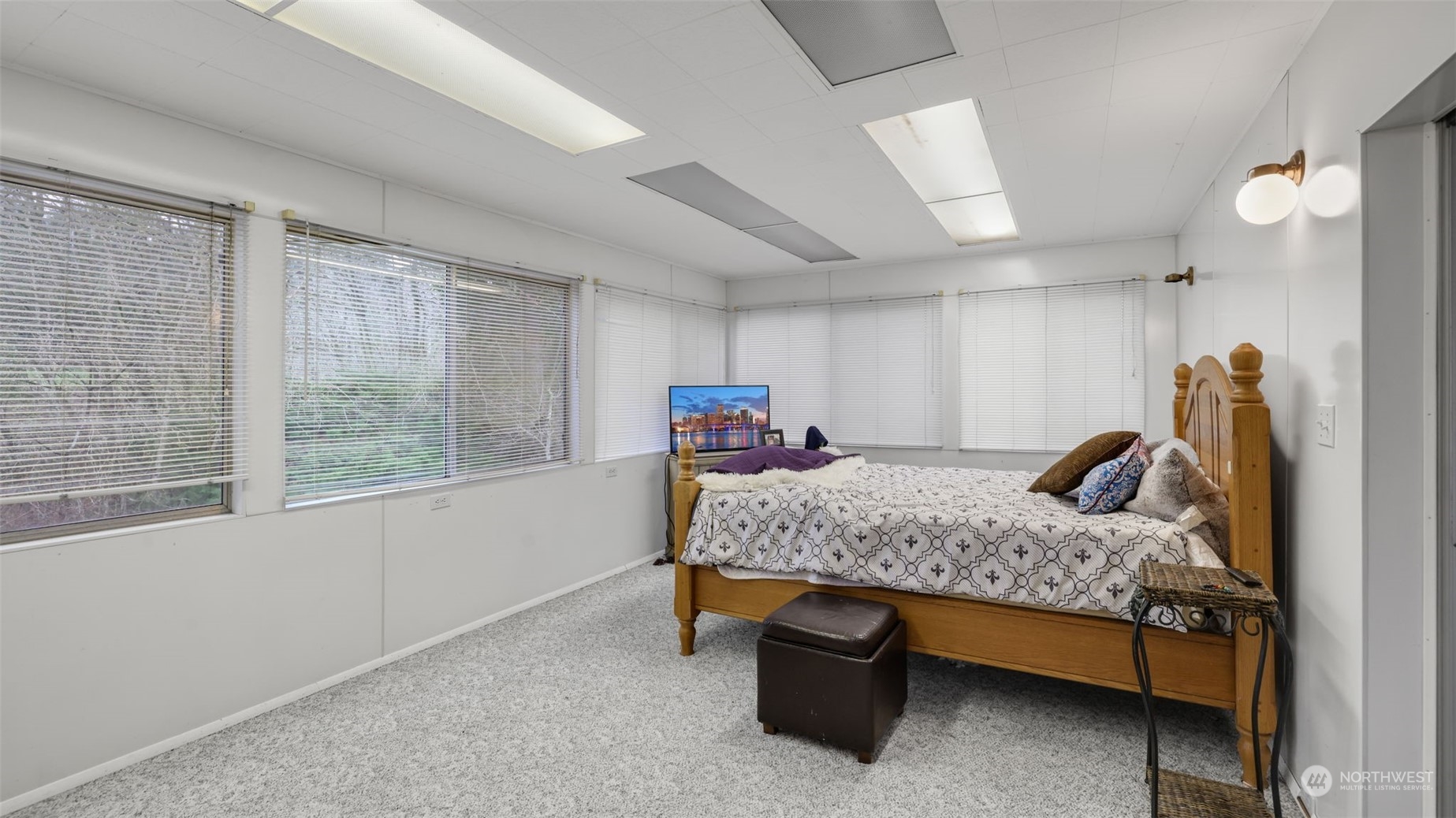 Primary bedroom features wall to wall windows!