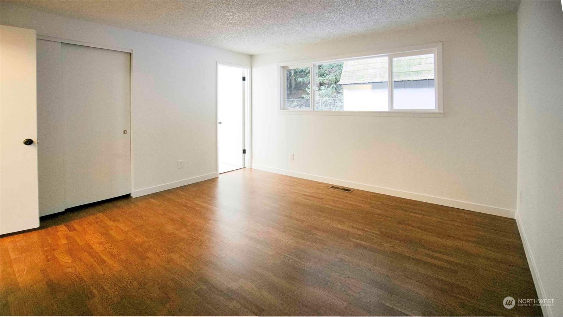 Primary bedroom with full bath and two closets.