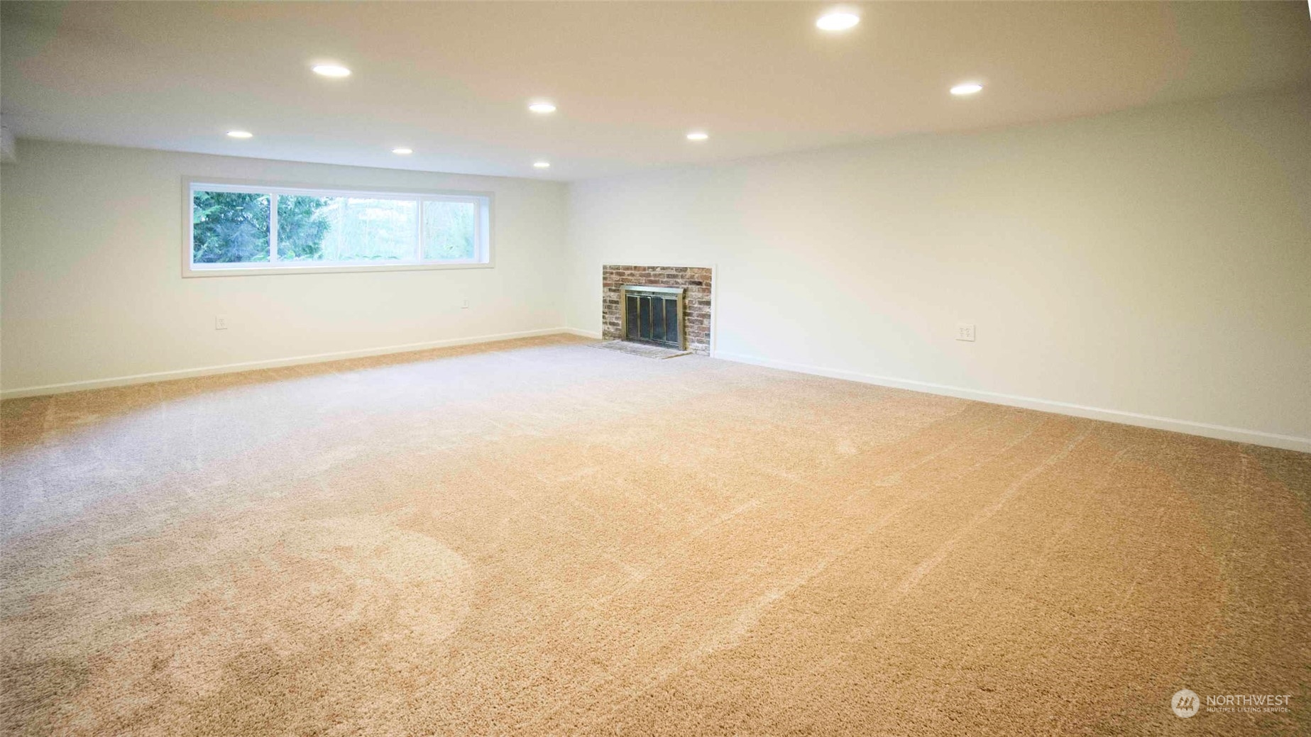 Lower level family room with fireplace.