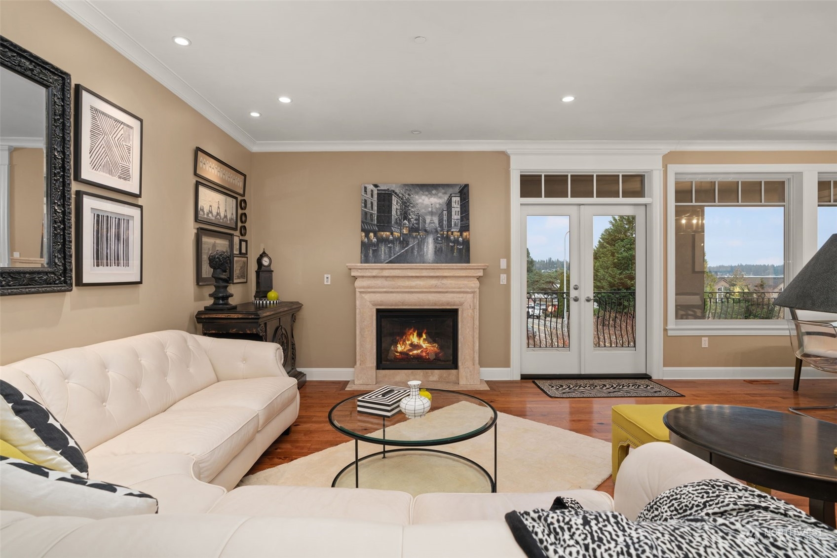 Lush landscaping and French doors provide beautiful curb appeal.