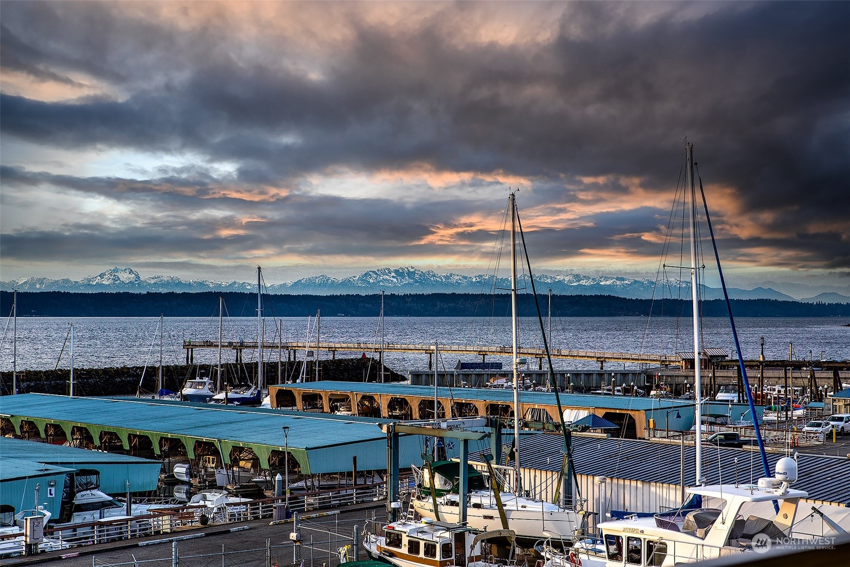 Views looking to the Olympic Mountains, the sunsets and the amazing clouds rolling in.   This is the Des Moines marina, which houses boats, yachts and sailboats.