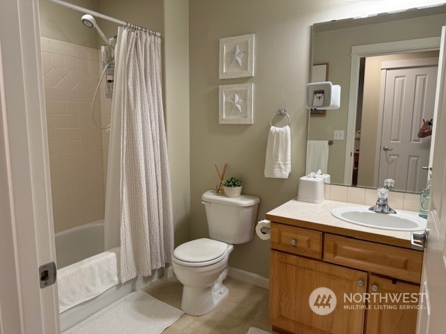 Guest bathroom with tub and shower.