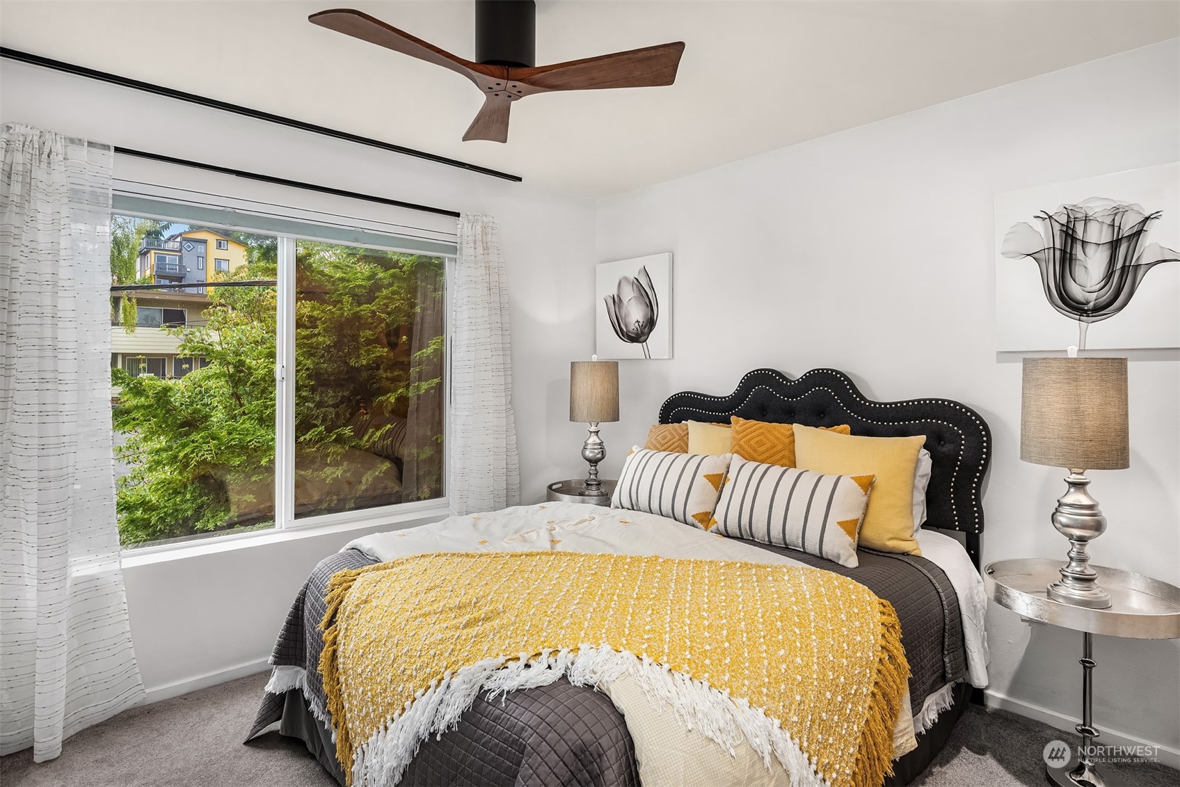 Guest bedroom with ceiling fan and room for a king bed