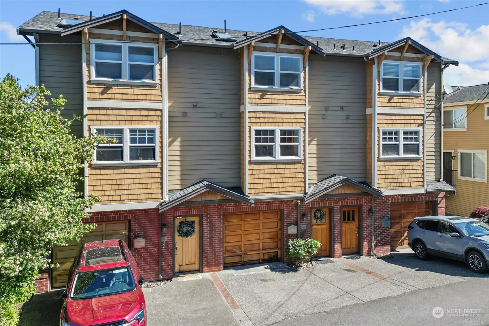 Main Entrance with Garage and Off-Street parking.