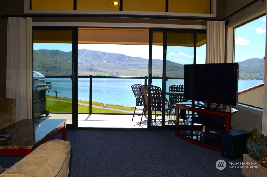 Sitting in the living area you get to view the water through the glass balcony railing.