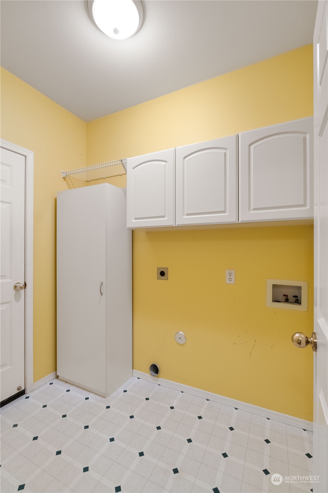 Laundry area w/additional storage leads to the Garage