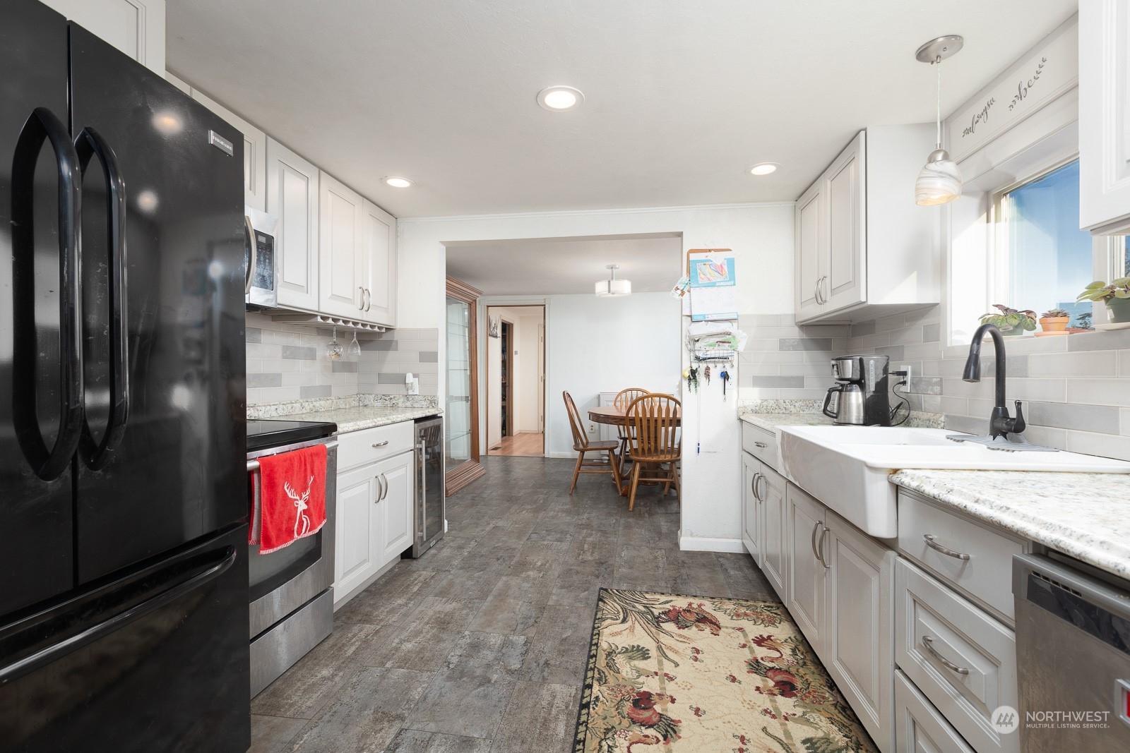 The house has a good layout, with the dining room entered off the kitchen and also featuring updated flooring.