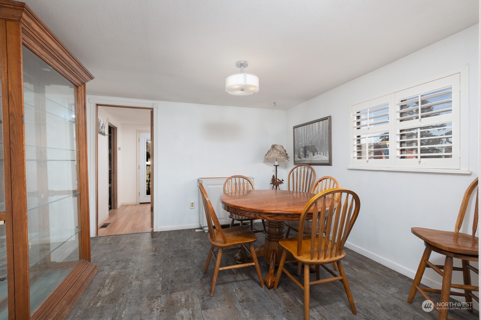 The plantation shutters, new flooring and updated lighting really create a warm look in here.