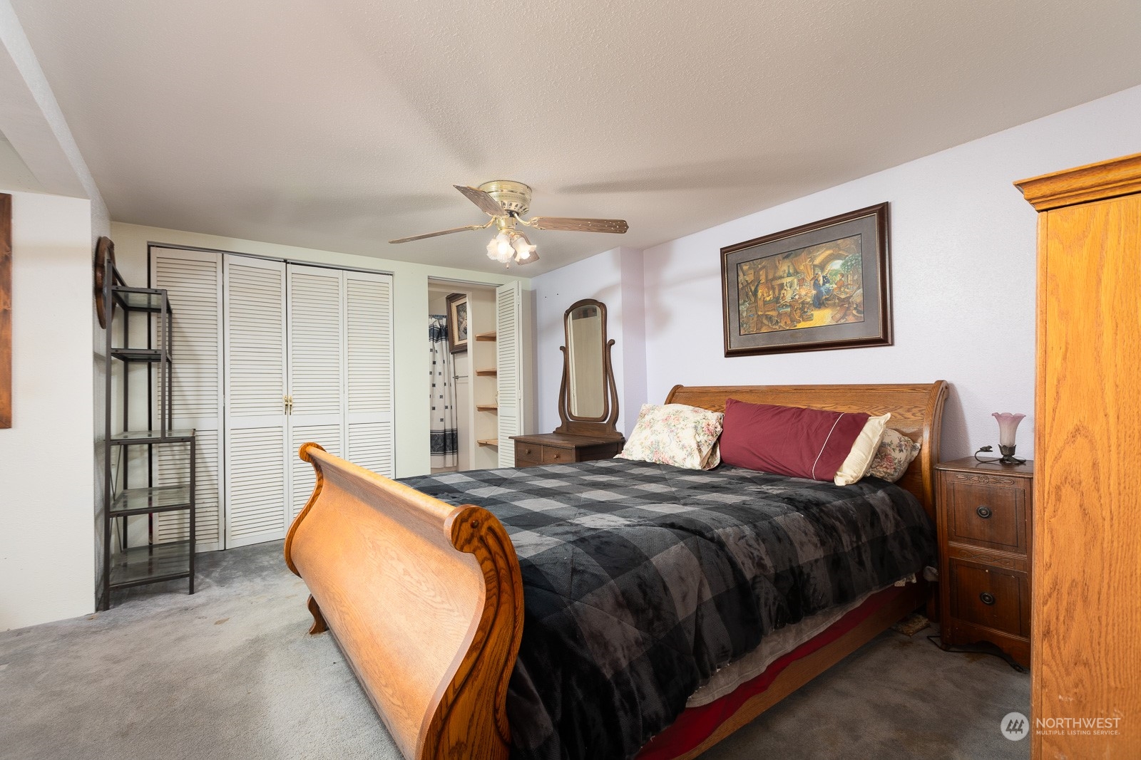 A large closet and a full bath are located off the bedroom.