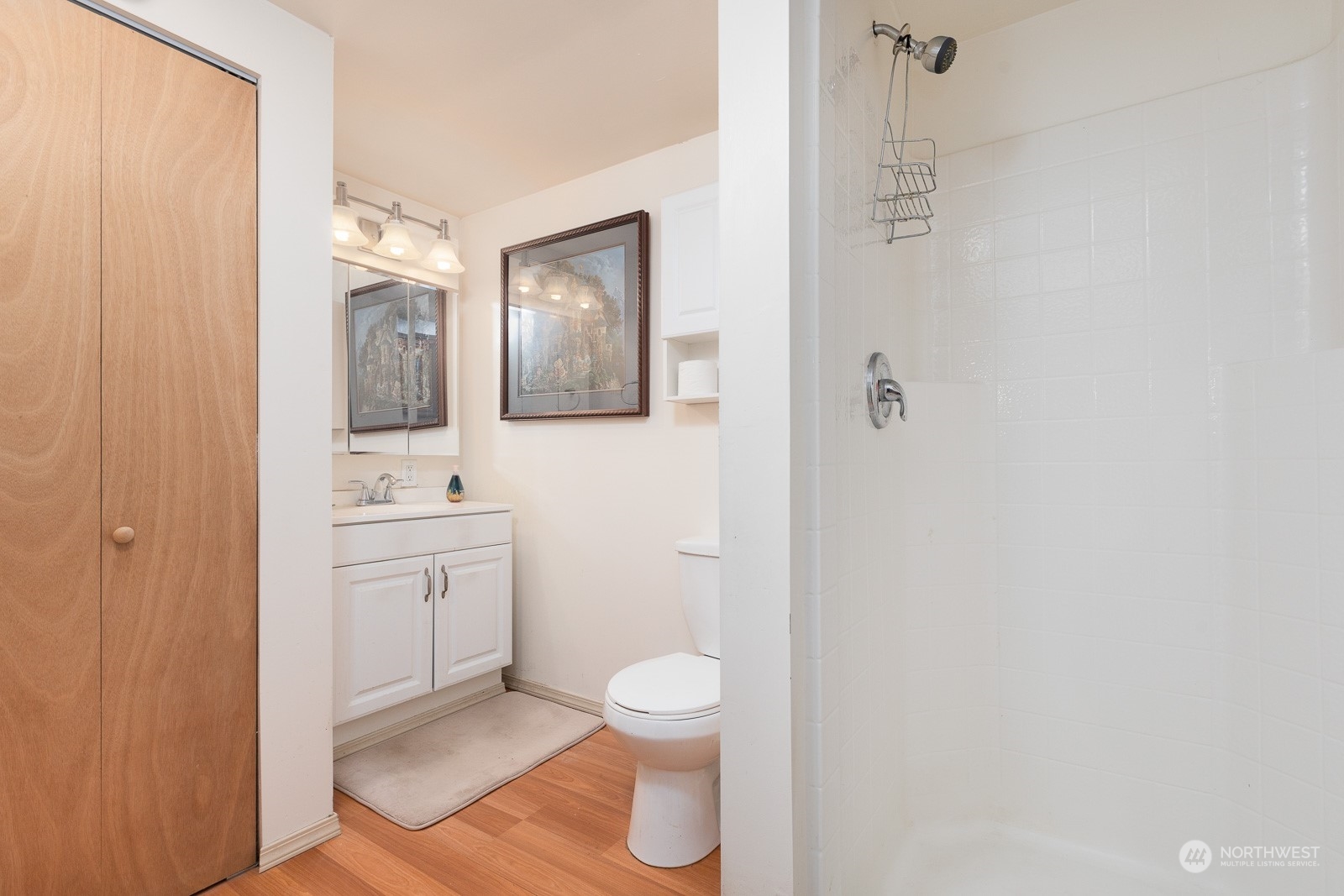 A nice bathroom with linen closet is attached to the primary bedroom. Walk right into the shower.