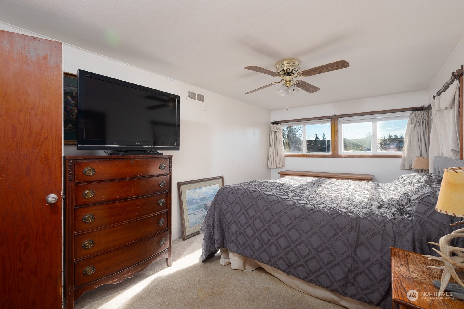 Warm and cozy and large is the second bedroom. It has it's own private doorway to the guest bathroom.