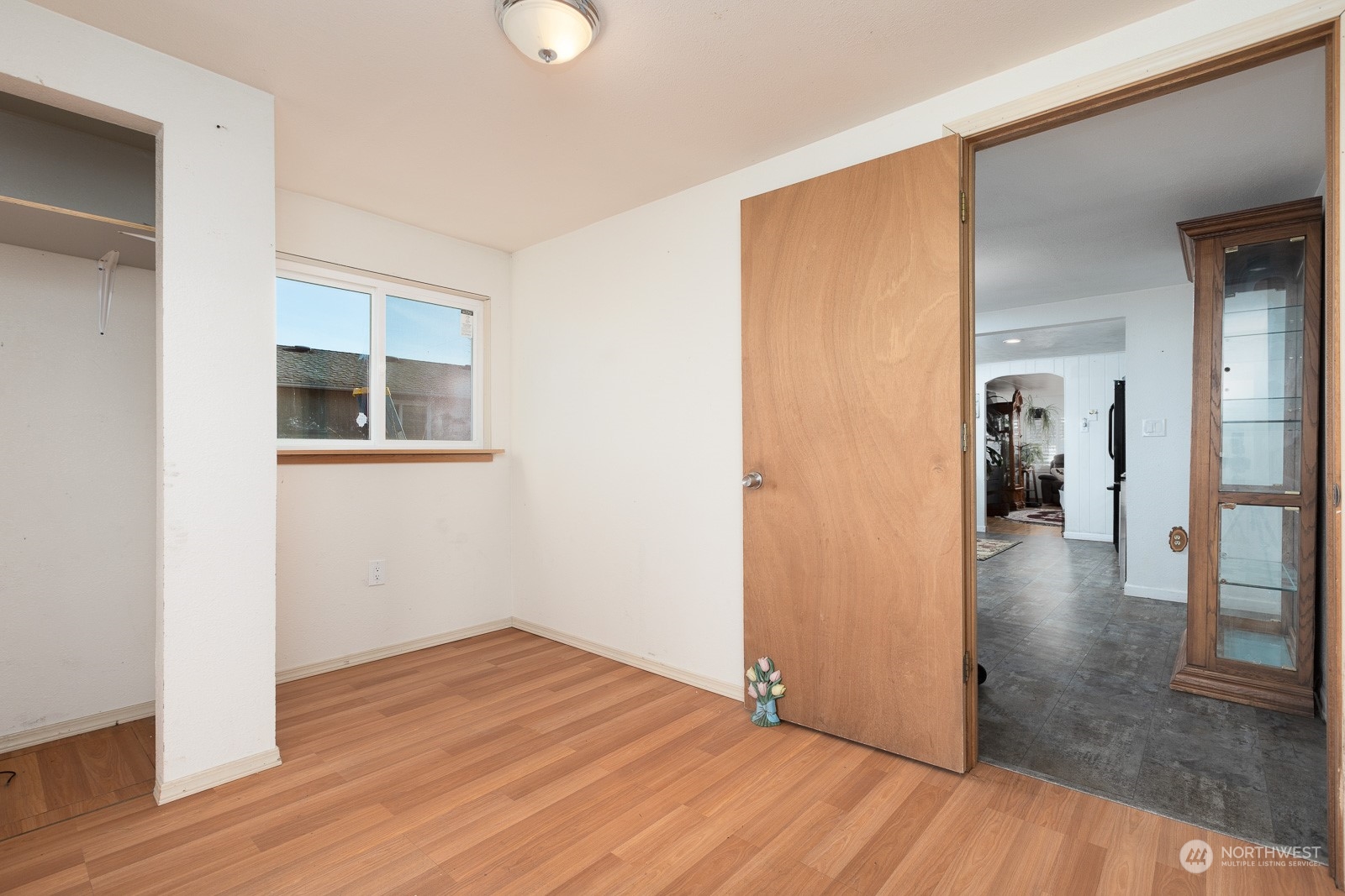 Third bedroom looking into dining room area.