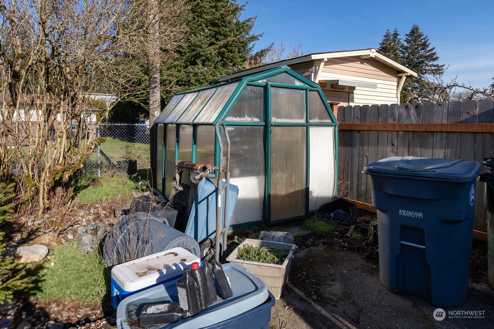 This is the back side deck and the window into the primary bedroom. Can you envision French doors here? Yes!