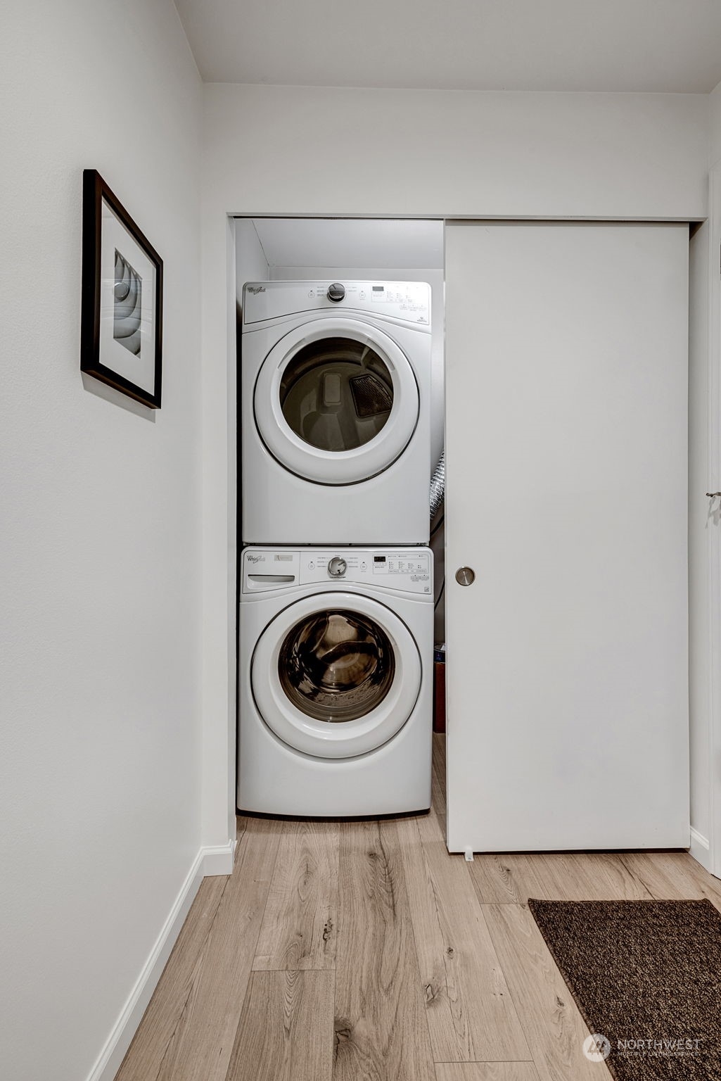 Convenient washer and dryer just inside with plenty of in unit storage!