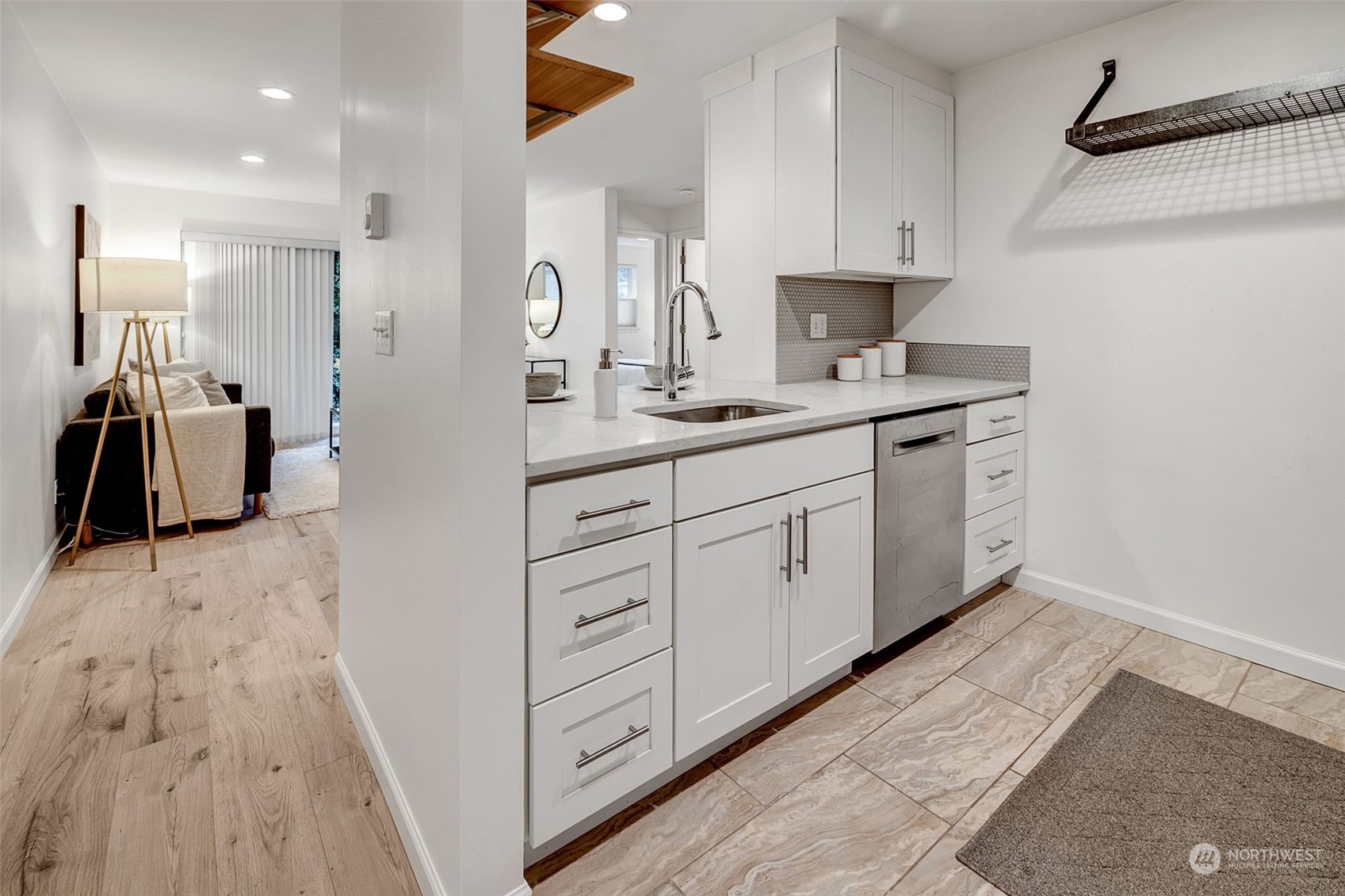 This fully renovated and updated, light and bright home features Quartz counter tops, stainless appliances, soft close cabinets and gorgeous tile floors.