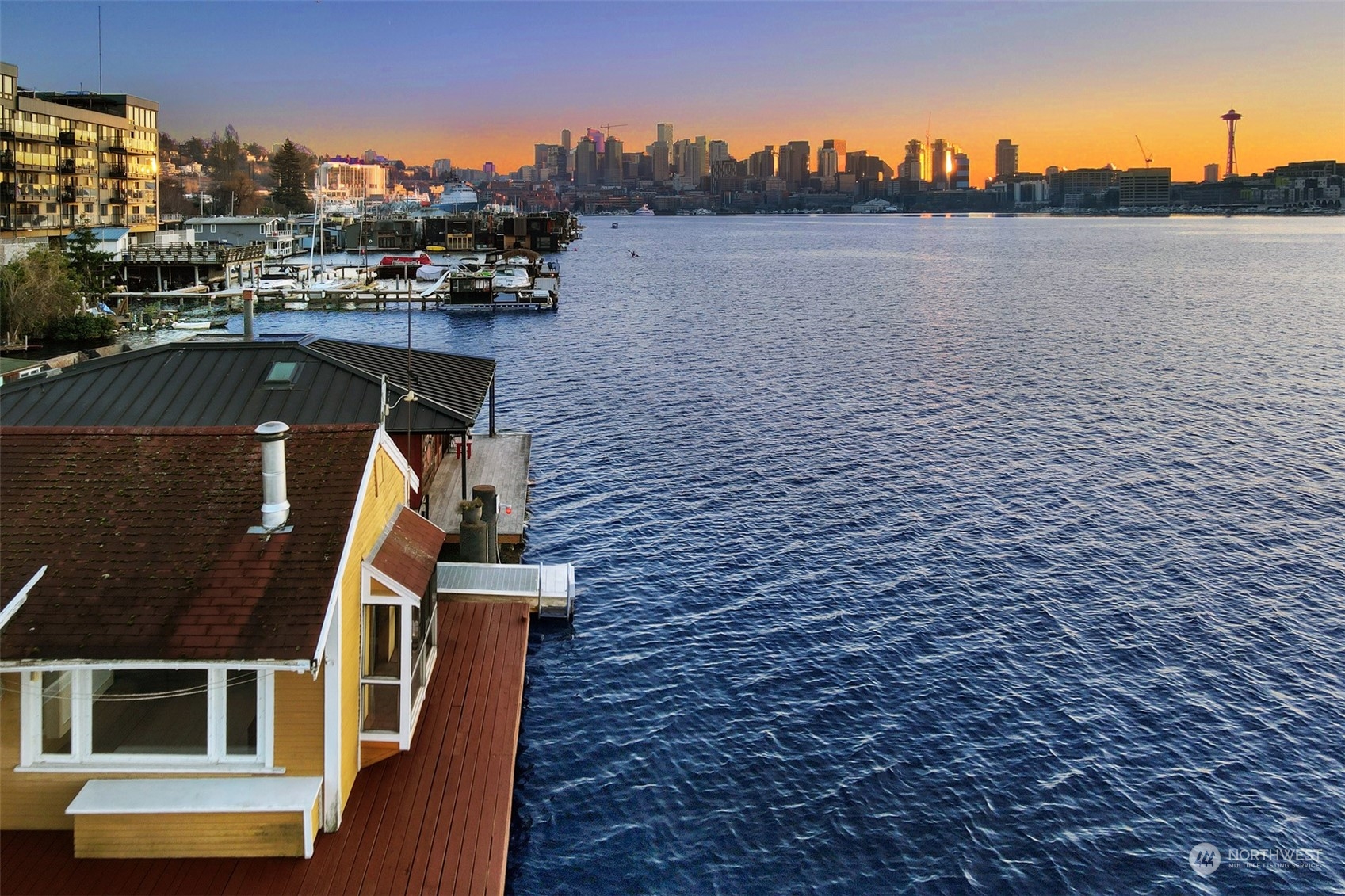 The survey map of the home shows the southwest corner of the float is over the Seattle Construction Limit which means the house can be replaced.